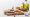 fresh raw salmon, nuts, eggs and avocado on wooden chopping board near oil isolated on grey,